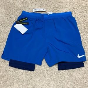 Blue Nike 2 in 1 reflective shorts. NWT Men’s L